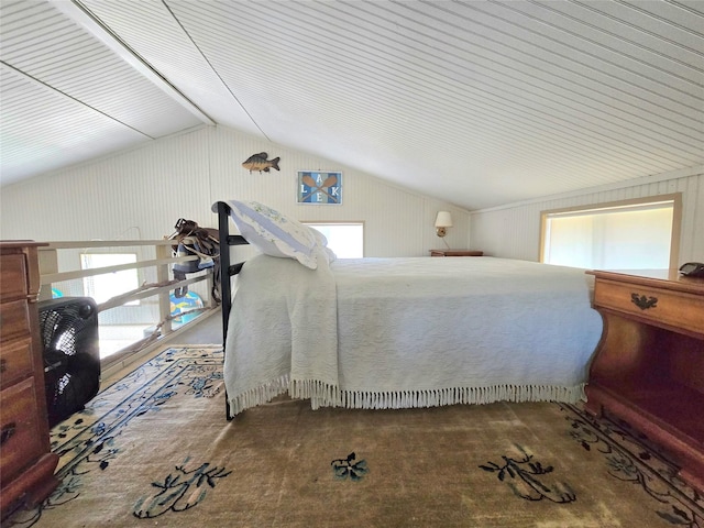 unfurnished bedroom with multiple windows, lofted ceiling, and carpet floors