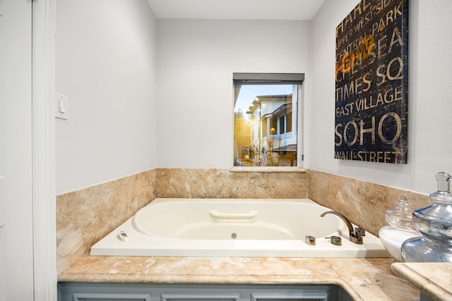 bathroom with a garden tub