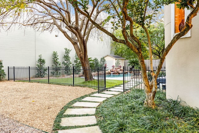 surrounding community featuring a swimming pool, an outdoor structure, and fence