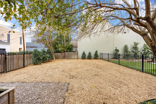 view of yard with a fenced backyard