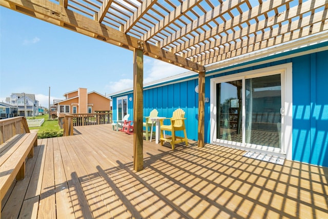 wooden deck with a pergola and a residential view