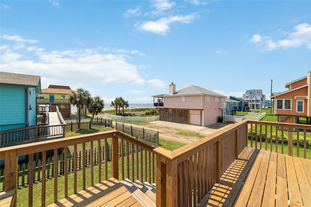 deck featuring a residential view and a fenced backyard