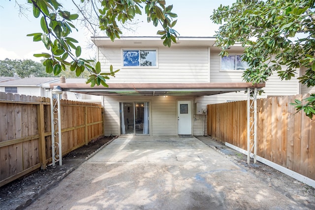 back of property with a patio area and a fenced backyard