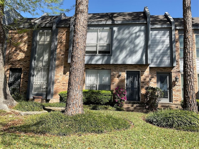 view of front of house with brick siding