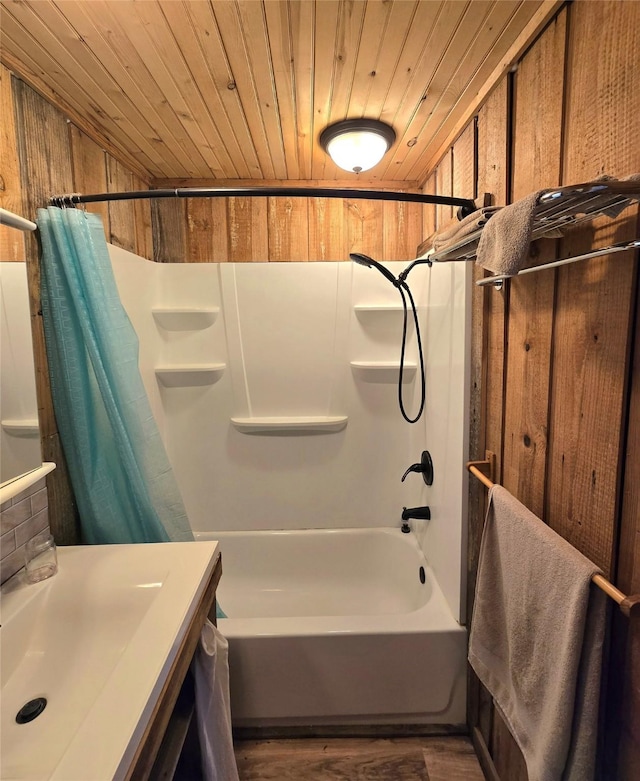 full bath featuring wooden walls, wood ceiling, wood finished floors, and shower / bath combination with curtain