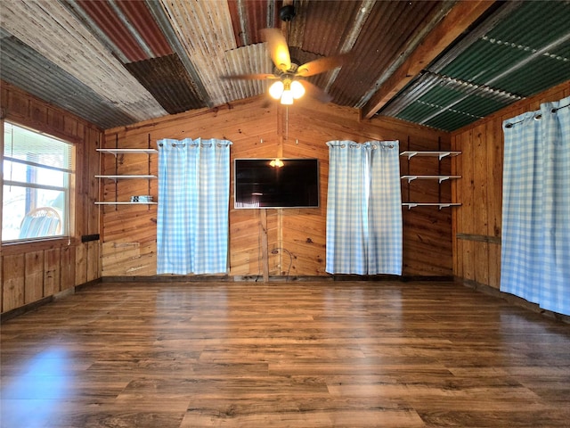 spare room with lofted ceiling, wood ceiling, wood finished floors, and wood walls