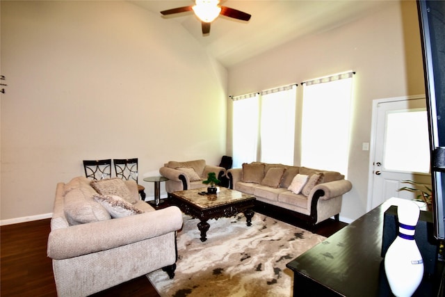 living room with ceiling fan, baseboards, high vaulted ceiling, and wood finished floors