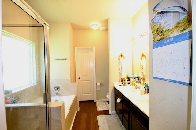 full bathroom featuring mail area, toilet, a stall shower, and a garden tub