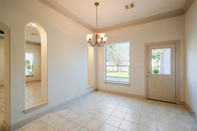 unfurnished dining area featuring arched walkways, visible vents, crown molding, and light tile patterned floors