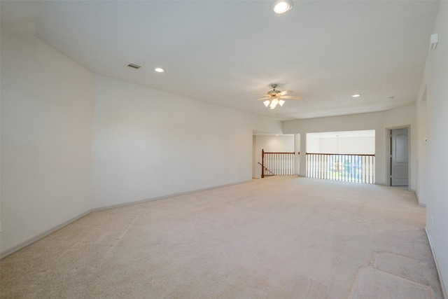 empty room with recessed lighting, carpet flooring, a ceiling fan, and visible vents