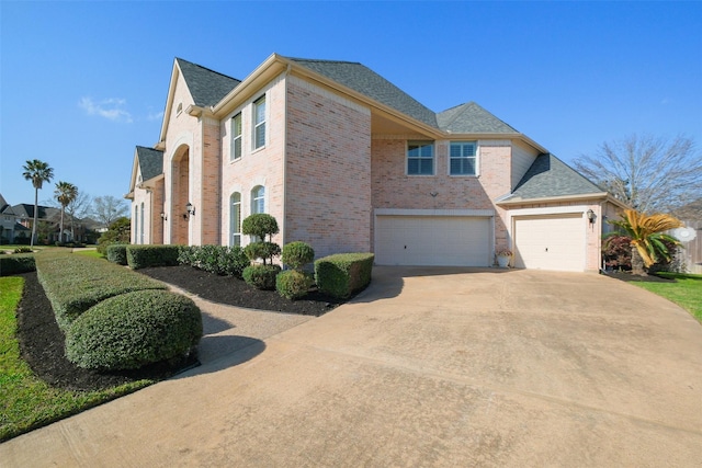 view of property exterior featuring brick siding, concrete driveway, and a shingled roof