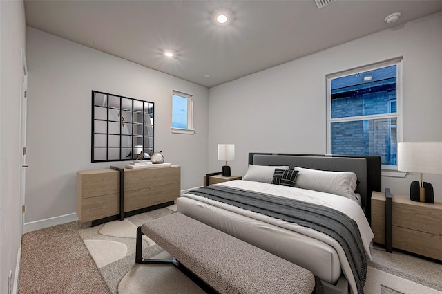 bedroom featuring recessed lighting, baseboards, and carpet