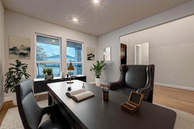 office featuring recessed lighting, light wood-style floors, and baseboards