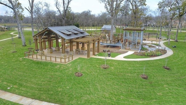 view of property's community with a lawn