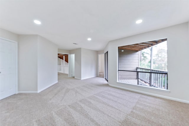 spare room with recessed lighting, baseboards, and carpet floors