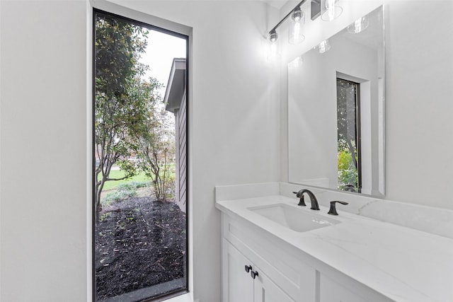 bathroom with a wealth of natural light and vanity