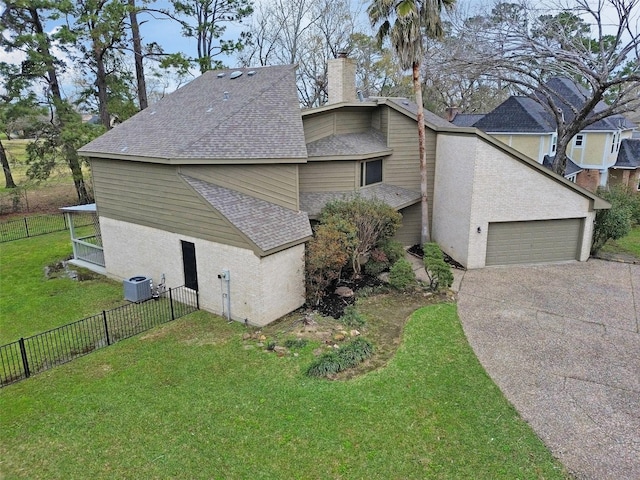 view of property exterior with a lawn, central AC, fence, a shingled roof, and a chimney