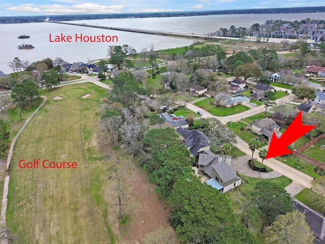 drone / aerial view with a residential view and a water view