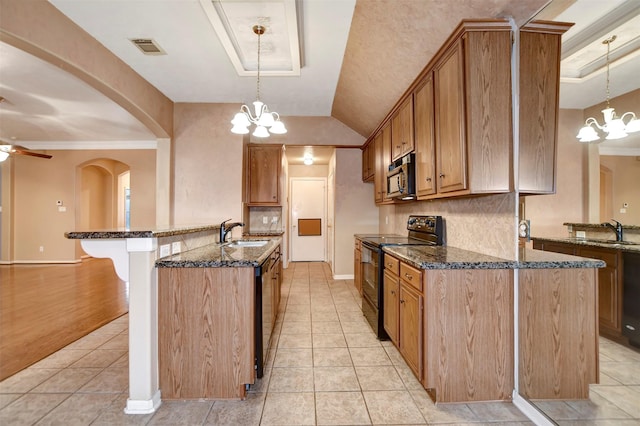 kitchen with visible vents, black electric range oven, a sink, dark stone countertops, and light tile patterned floors