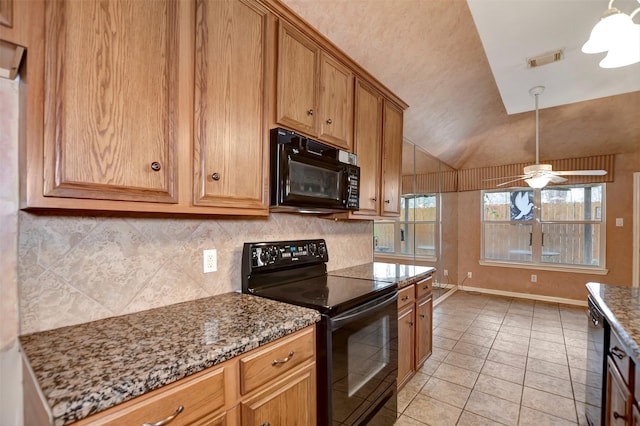 kitchen with tasteful backsplash, visible vents, vaulted ceiling, light tile patterned floors, and black appliances