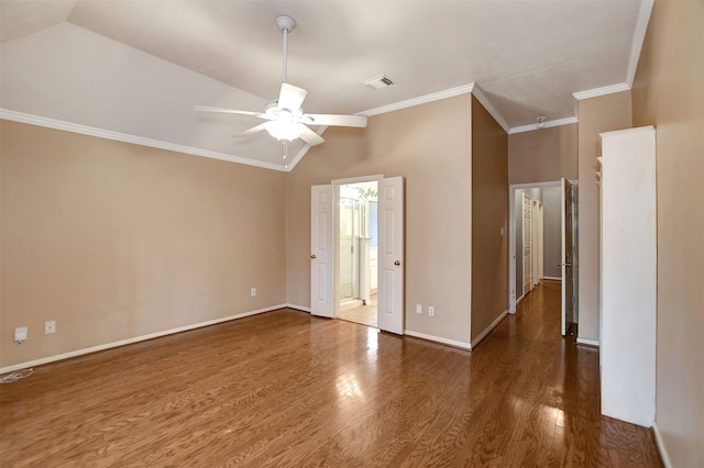 empty room featuring visible vents, baseboards, ceiling fan, ornamental molding, and wood finished floors