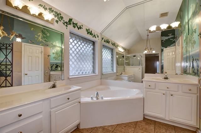 full bathroom with a bath, a shower stall, lofted ceiling, and a sink