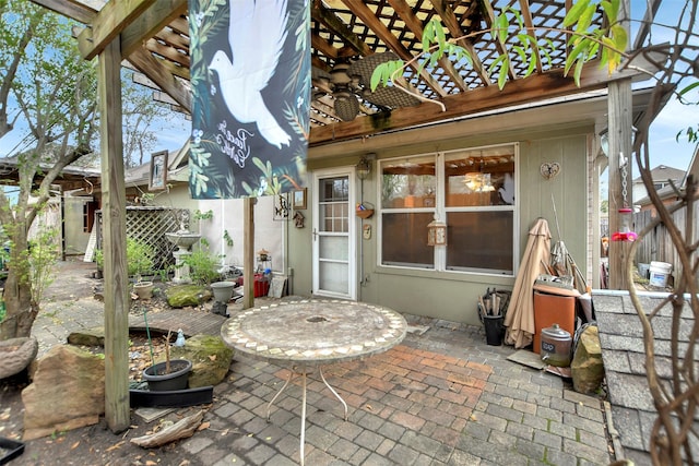 view of patio featuring a pergola and fence