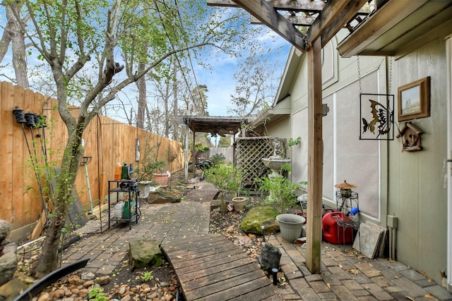 view of yard with a patio area, a pergola, and a fenced backyard