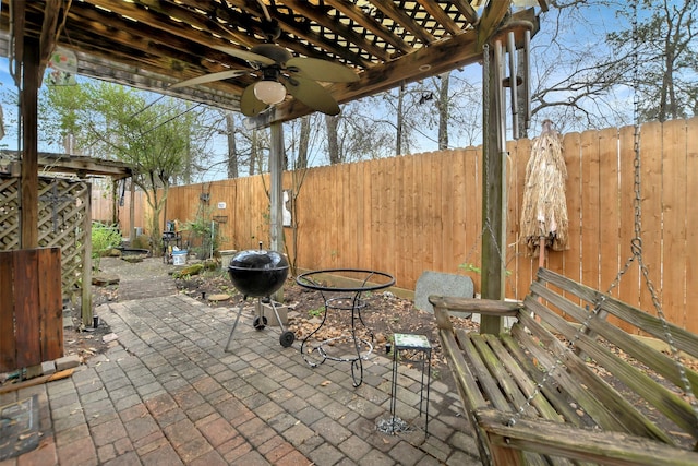 view of patio / terrace with grilling area, ceiling fan, and a fenced backyard