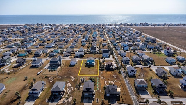 bird's eye view featuring a water view and a residential view