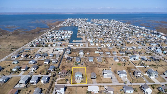 birds eye view of property featuring a residential view and a water view