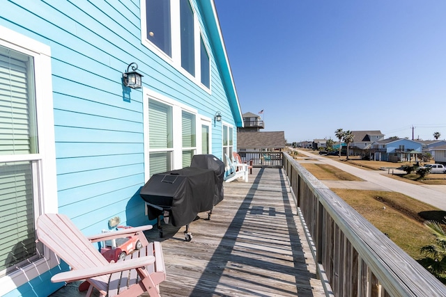 wooden terrace featuring a residential view