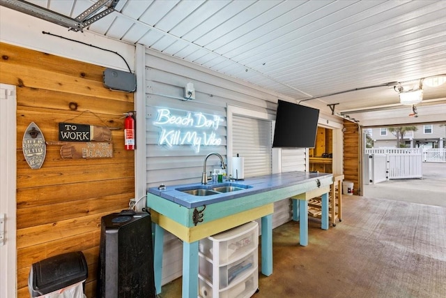 kitchen featuring a sink and carpet flooring