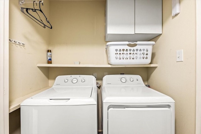 laundry area with washing machine and clothes dryer