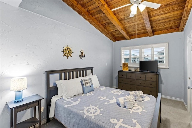 carpeted bedroom with ceiling fan, wooden ceiling, lofted ceiling with beams, and baseboards