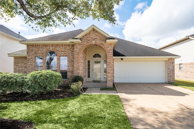 view of front of home featuring concrete driveway, an attached garage, brick siding, and a shingled roof