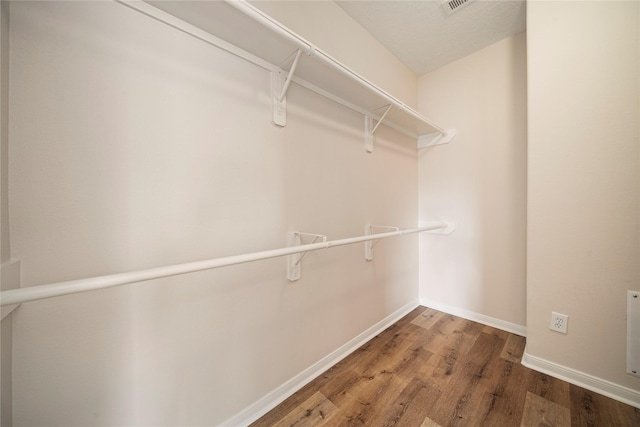 spacious closet featuring wood finished floors