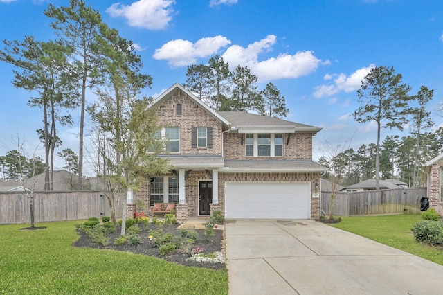 view of front of house with brick siding, an attached garage, fence, a front yard, and driveway