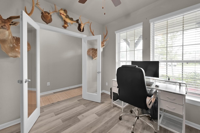 office space featuring light wood-style flooring, french doors, baseboards, and ceiling fan