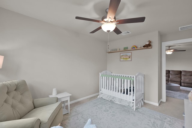 bedroom with visible vents, ceiling fan, baseboards, and carpet