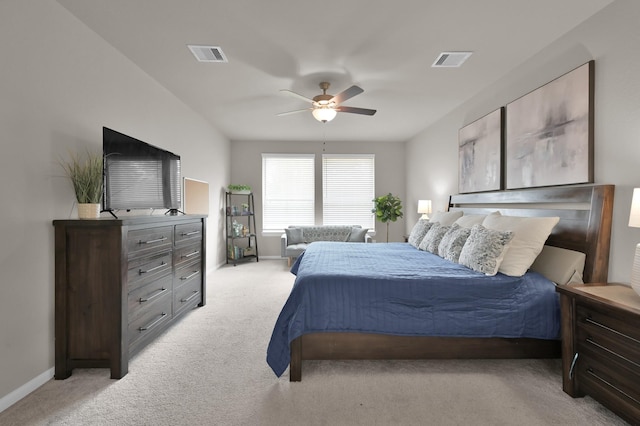 bedroom featuring visible vents, light carpet, baseboards, and a ceiling fan