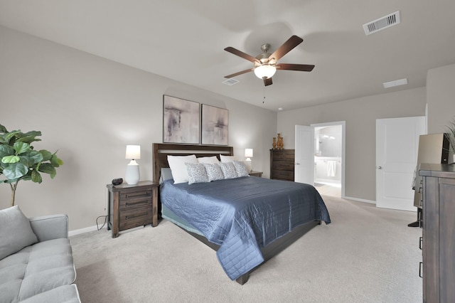 bedroom with baseboards, visible vents, and light carpet