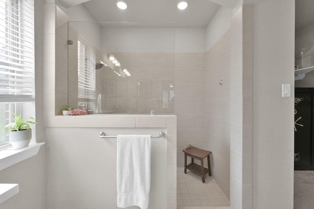 full bath with recessed lighting, a healthy amount of sunlight, and walk in shower