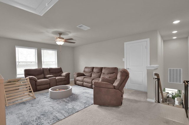 living room with a ceiling fan, recessed lighting, carpet, and visible vents