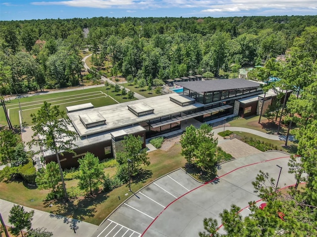 birds eye view of property with a wooded view