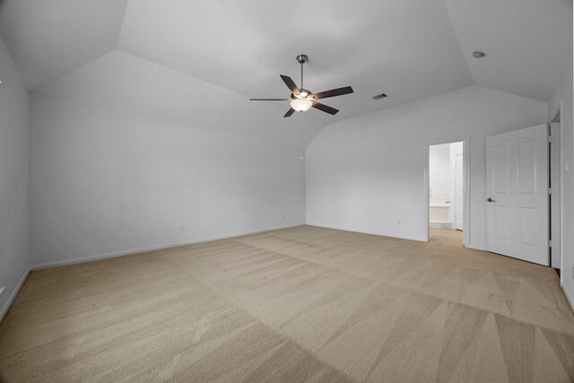 bonus room with a ceiling fan, visible vents, baseboards, vaulted ceiling, and light colored carpet