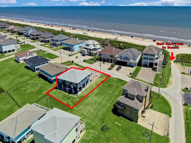 bird's eye view with a beach view, a residential view, and a water view