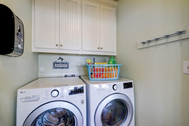 laundry room featuring cabinet space and independent washer and dryer