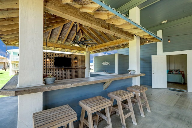 view of patio / terrace with outdoor dry bar, a gazebo, and ceiling fan