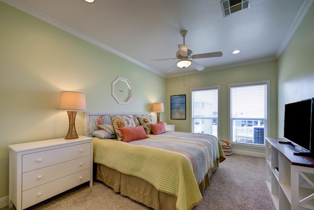 bedroom with visible vents, ornamental molding, a ceiling fan, baseboards, and light colored carpet